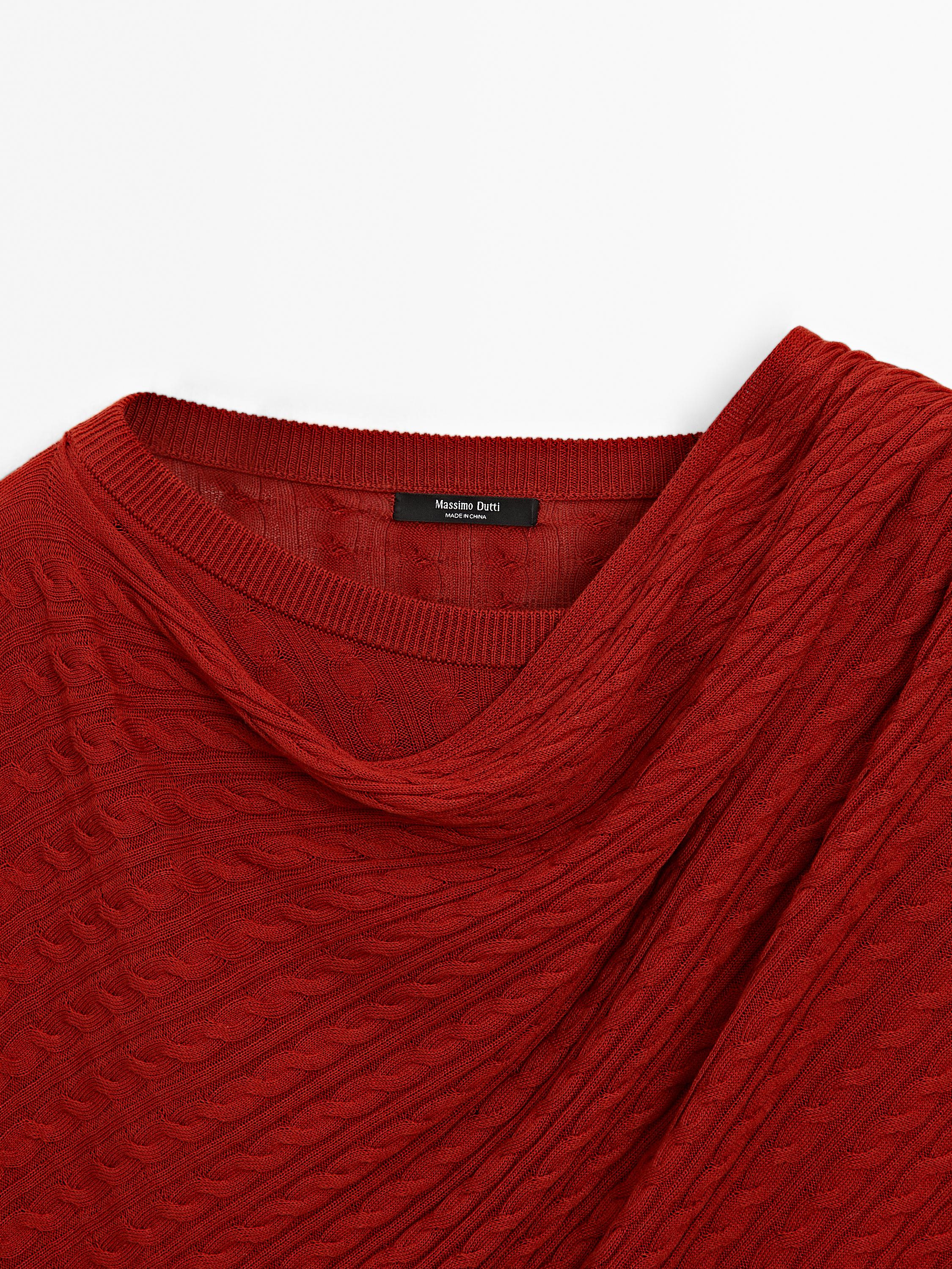 Cable-knit sweater with scarf detail